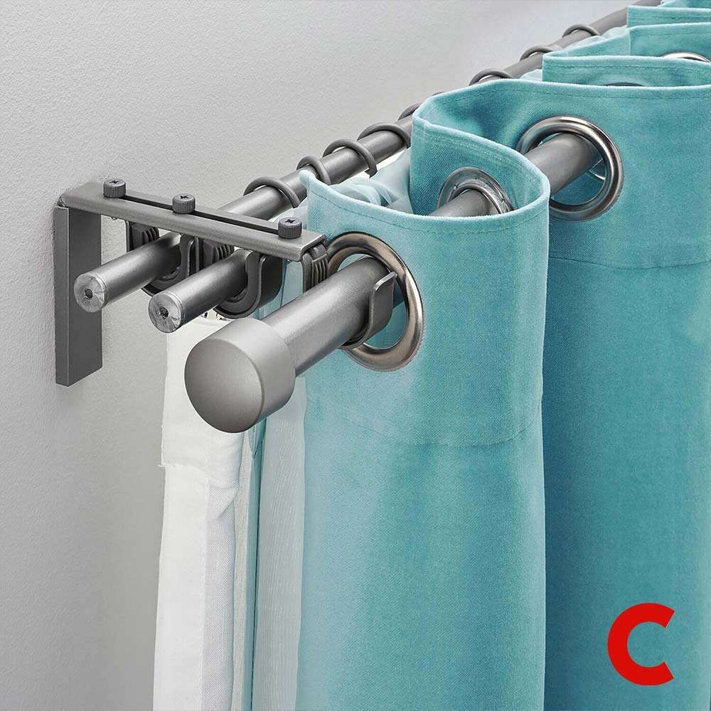 Grey double curtain pole on a wall bracket, a white sheer on the inner rod and a turquoise eyelet panel outside