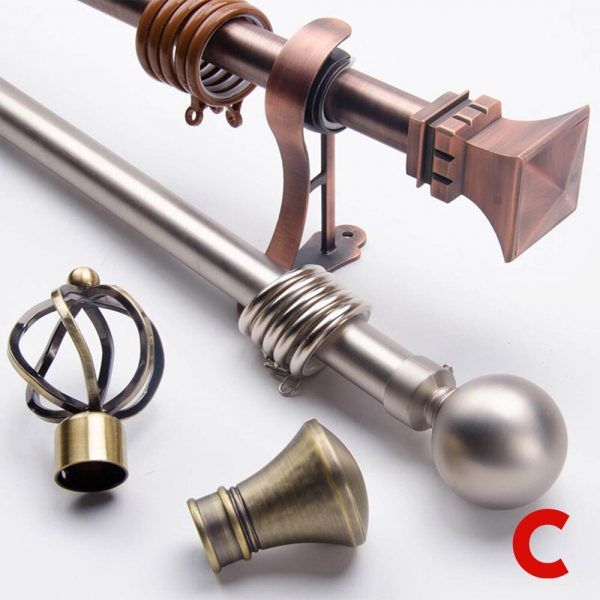 Copper and brushed nickel curtain poles with brackets and finials, shown beside two loose antique brass finials
