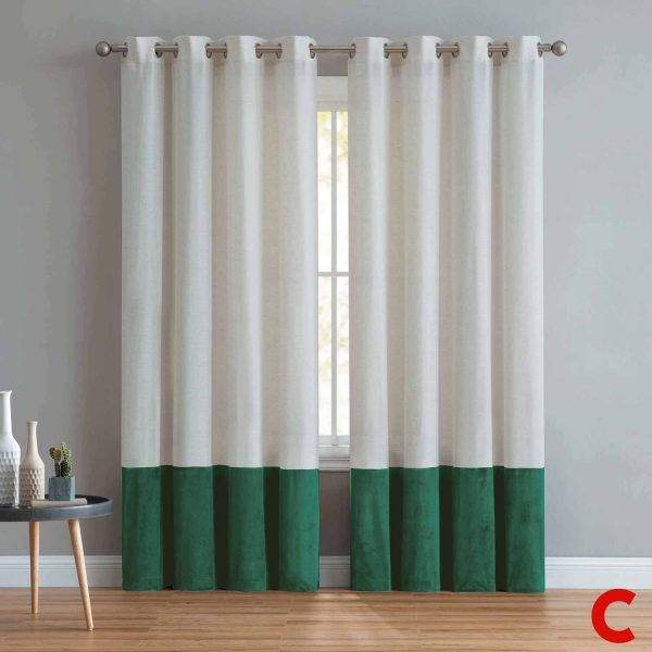 Cream eyelet curtains with a deep green colour-block hem, hung on a steel pole across a narrow window