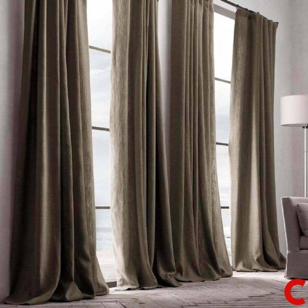 Mushroom-taupe panels drawn along a full-height window wall overlooking the sea, pooling on timber boards