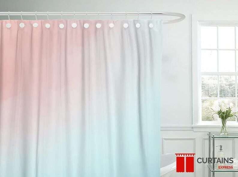 Pink-to-mint ombre shower curtain on white rings and a curved rail in a white panelled bathroom